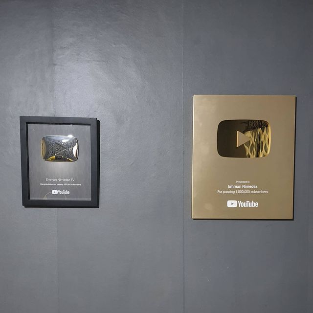 Emman Nimedez' s silver and golden play buttons on wall.